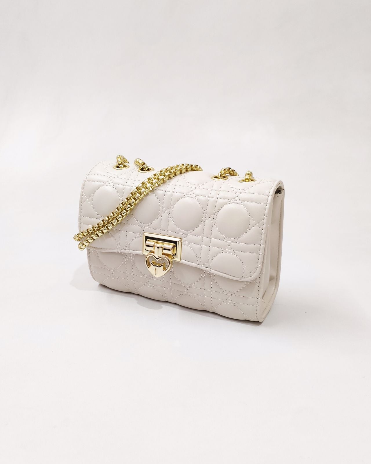 Quilted Offwhite Sling bag with Golden metal accent