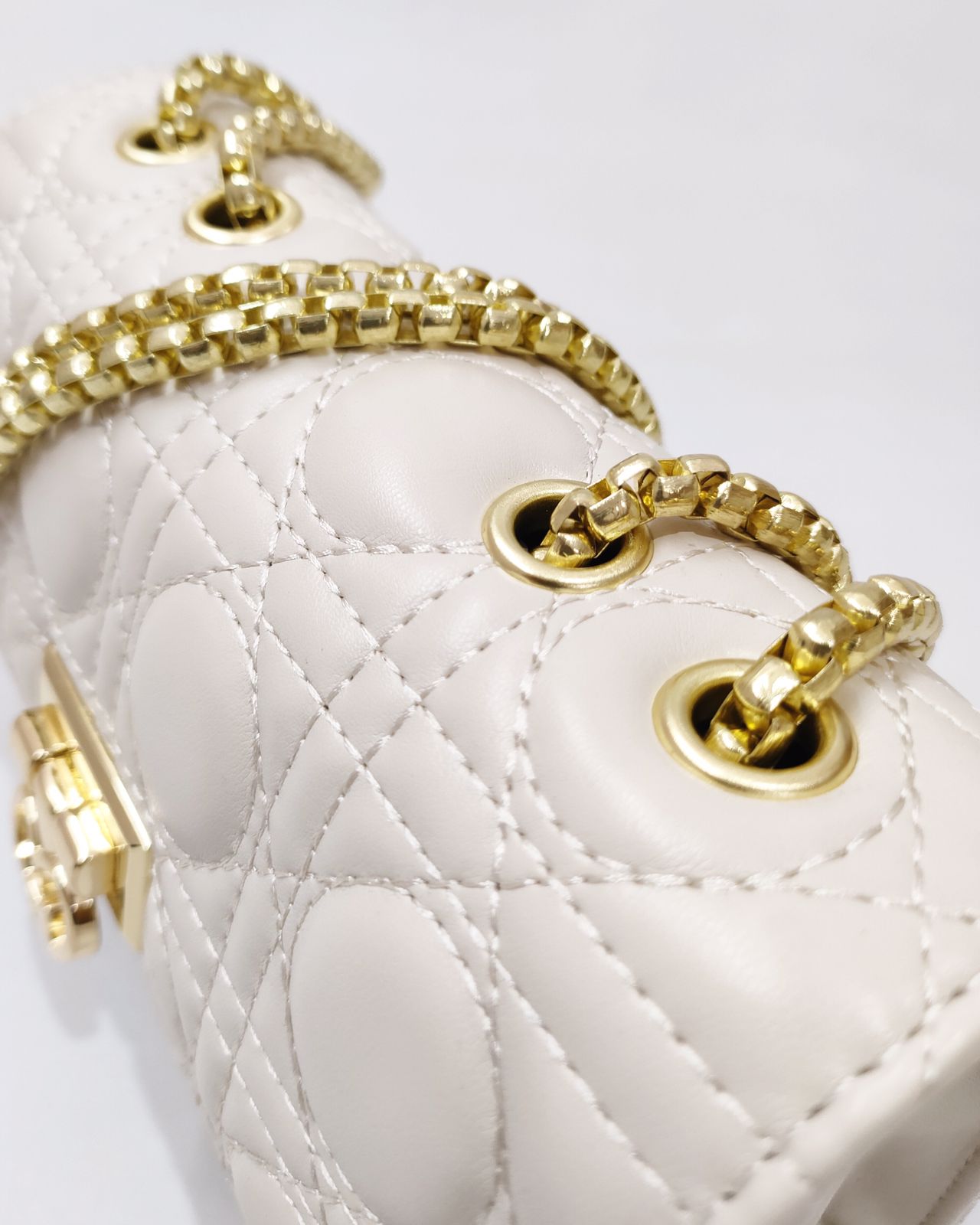 Quilted Offwhite Sling bag with Golden metal accent