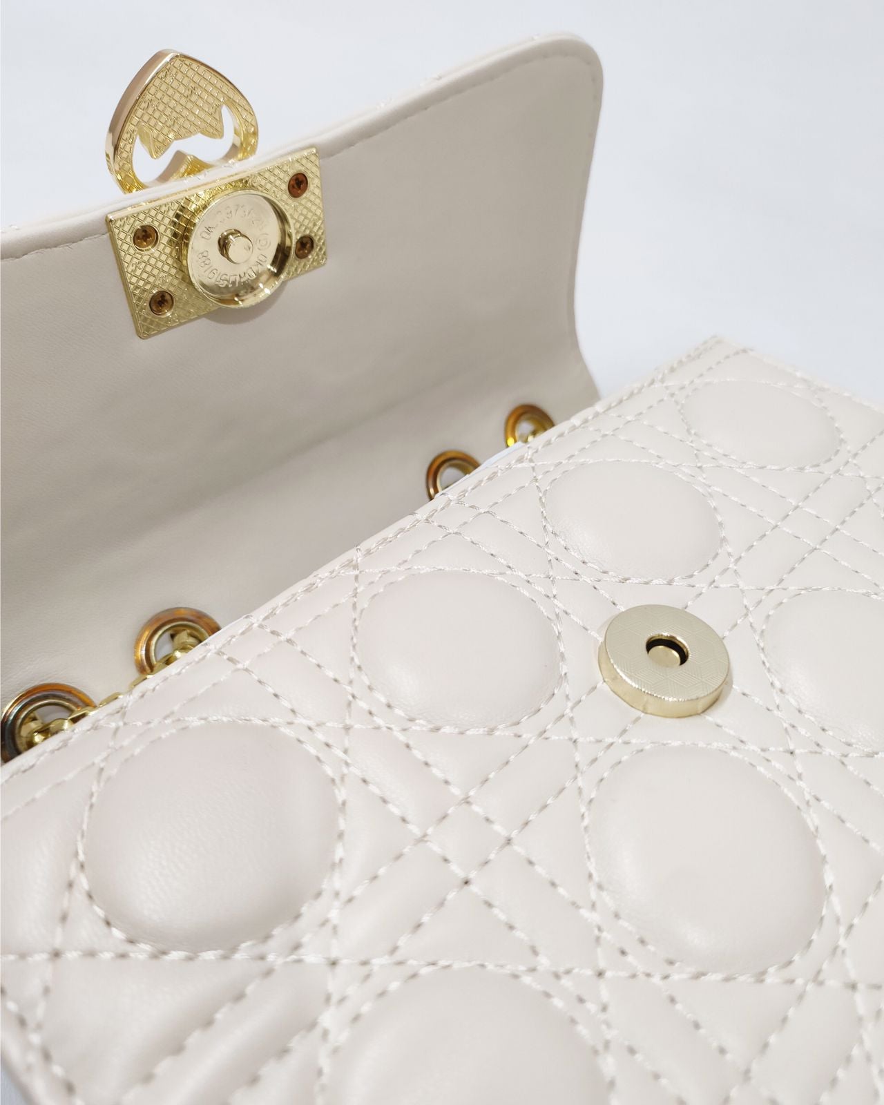 Quilted Offwhite Sling bag with Golden metal accent
