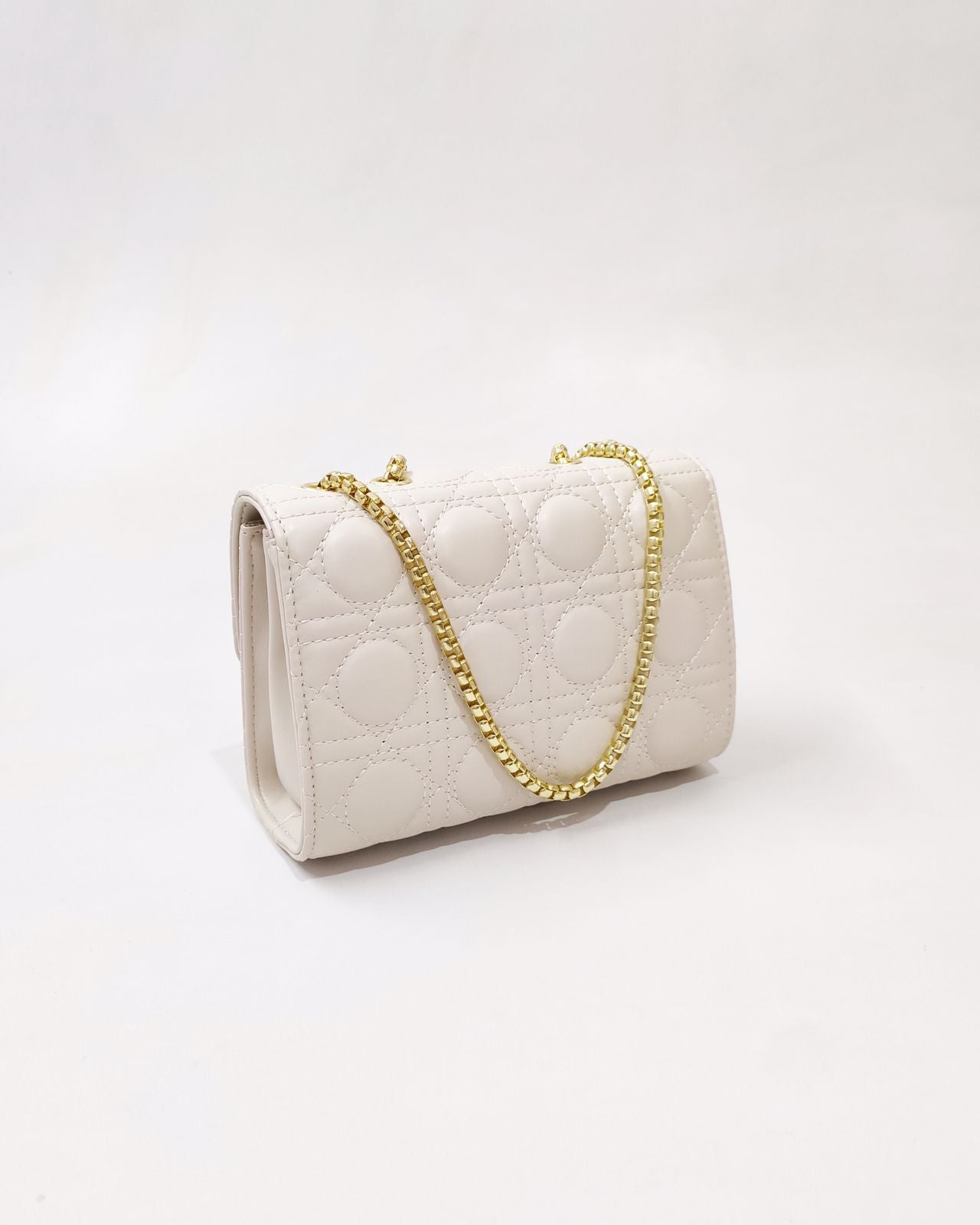 Quilted Offwhite Sling bag with Golden metal accent