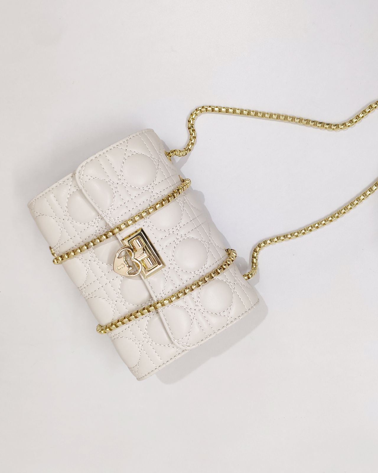 Quilted Offwhite Sling bag with Golden metal accent