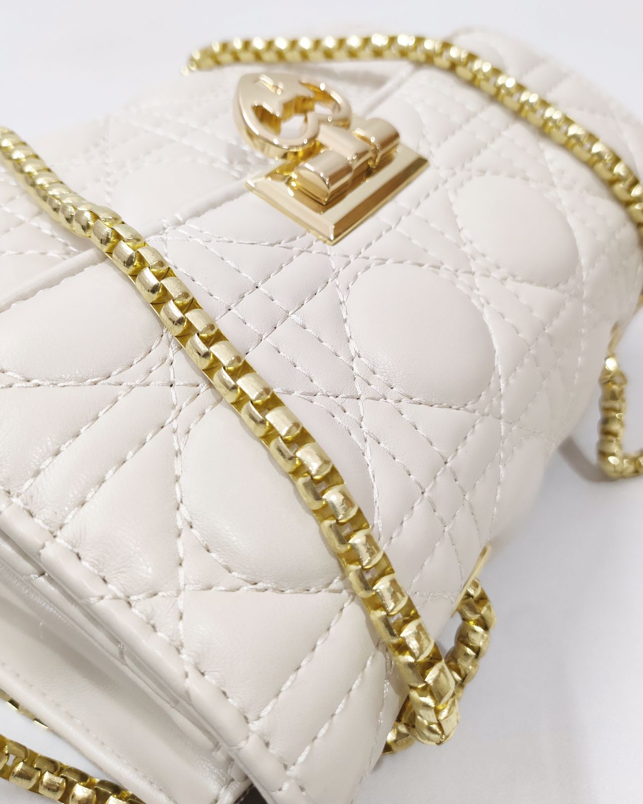 Quilted Offwhite Sling bag with Golden Heart shape metal accent