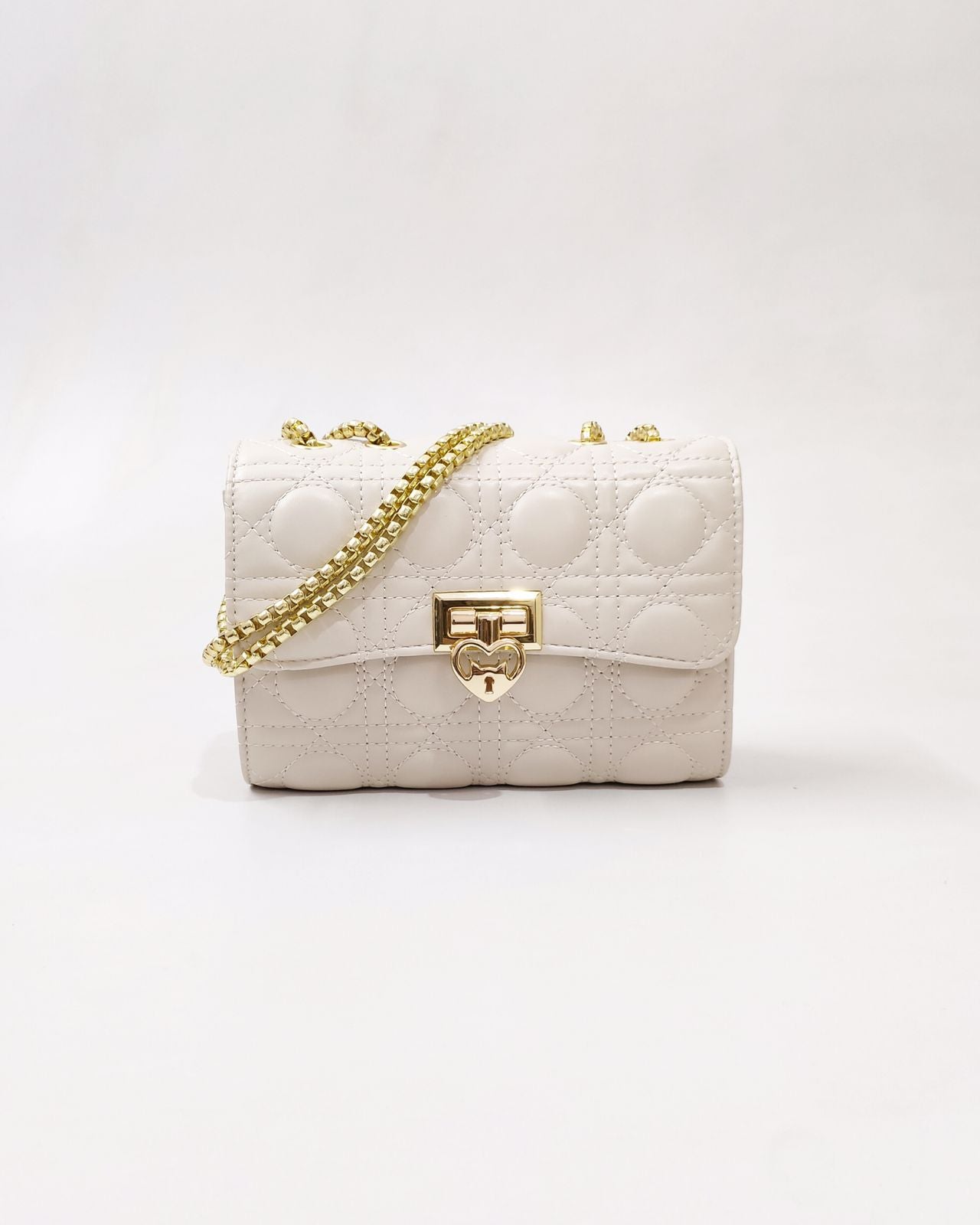 Quilted Offwhite Sling bag with Golden Heart shape metal accent