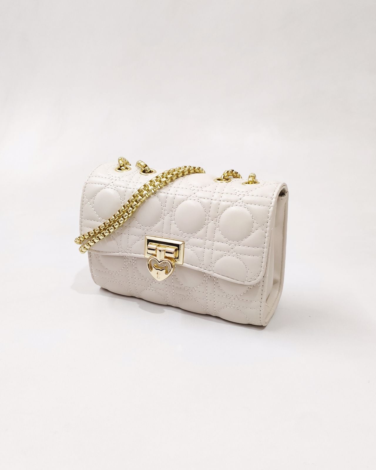 Quilted Offwhite Sling bag with Golden Heart shape metal accent