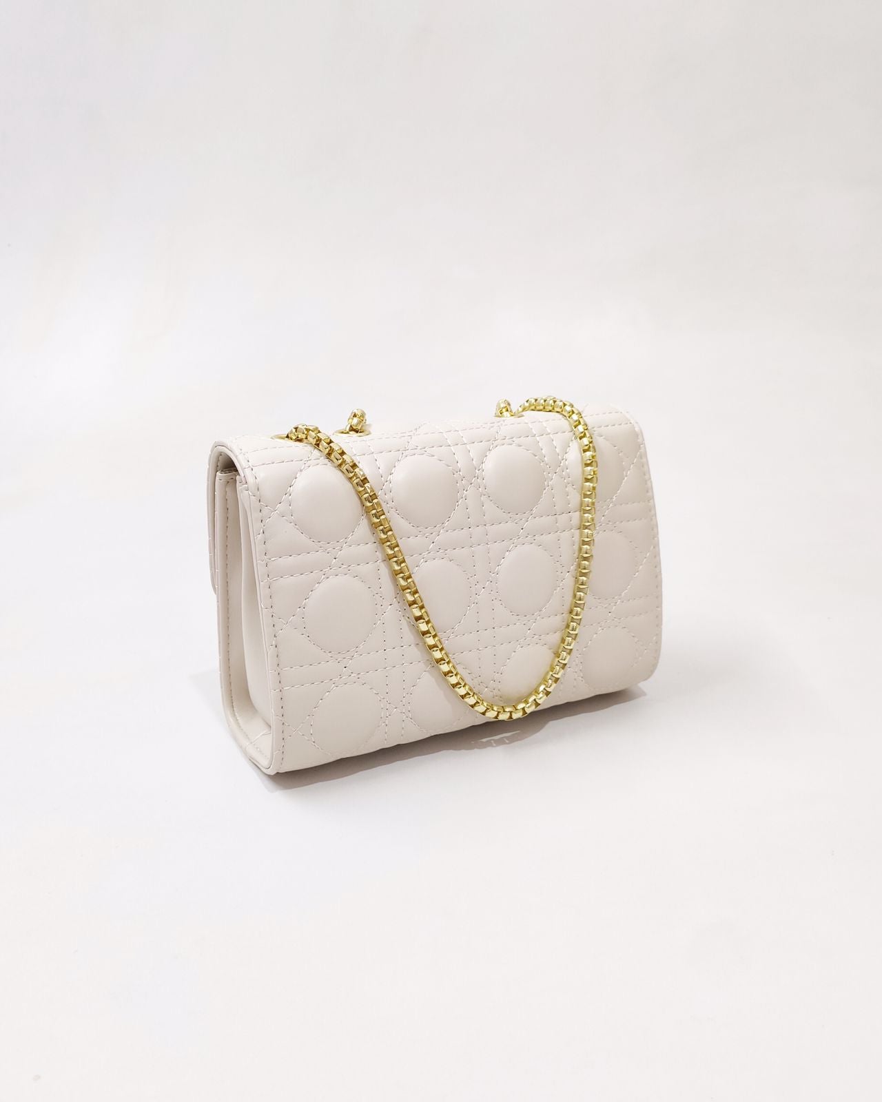 Quilted Offwhite Sling bag with Golden Heart shape metal accent