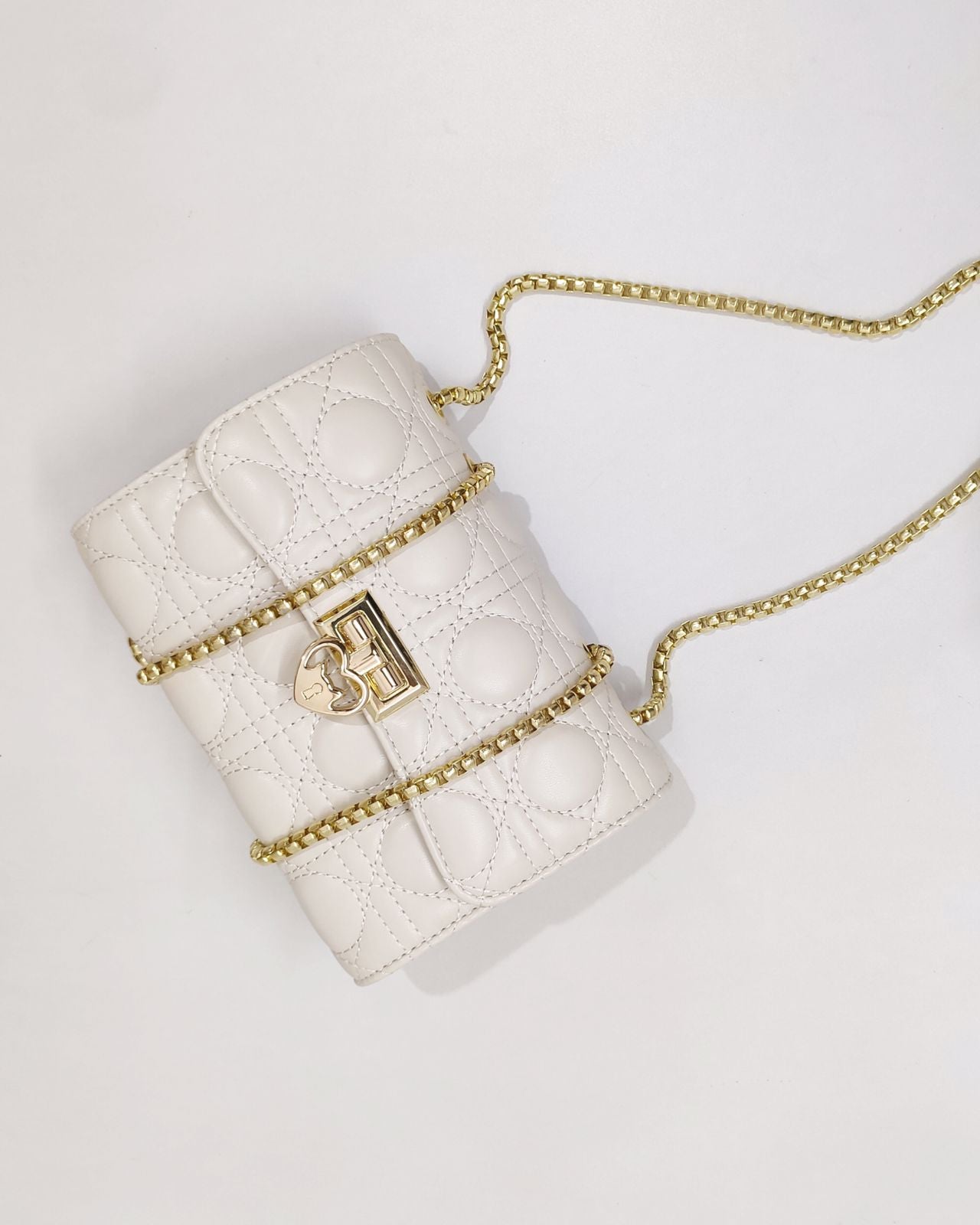 Quilted Offwhite Sling bag with Golden Heart shape metal accent