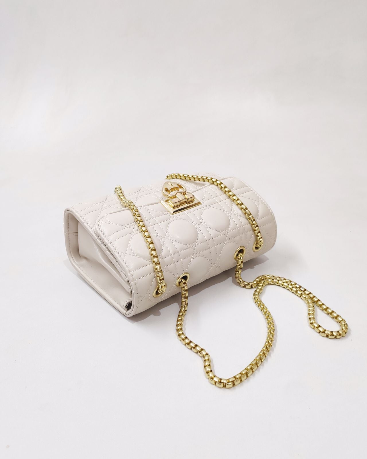 Quilted Offwhite Sling bag with Golden Heart shape metal accent